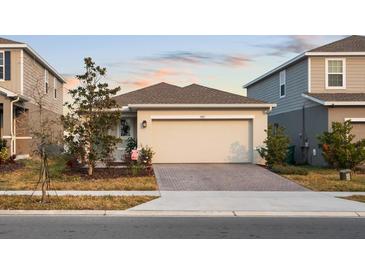 Single-story home with attached garage and landscaped yard at 3005 Lake Tahoe St, Deland, FL 32724