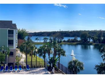 Stunning lake view with lush landscaping and a fountain at 3250 Corona Village Way # 302, Orlando, FL 32835