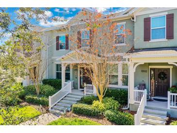 Two-story townhome with front porch and landscaping at 15508 Blackbead St, Winter Garden, FL 34787