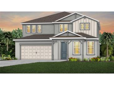 Two-story home with gray siding, a neutral-colored door, and a three-car garage at 3393 Orange Rose Loop, Apopka, FL 32712
