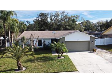 Attractive single-story house with a landscaped lawn and two-car garage at 127 Kaywood Dr, Sanford, FL 32771