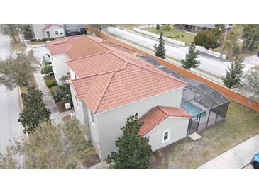 Aerial view of home with pool and Spanish tile roof at 1230 Las Fuentes Dr, Kissimmee, FL 34746