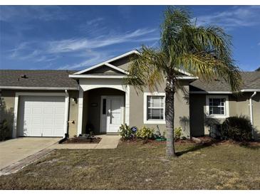 Inviting exterior of a single-story home with a palm tree and well-maintained lawn at 241 Shady Ln, Deland, FL 32724