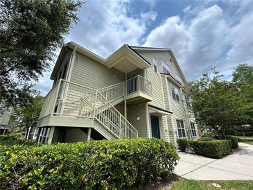 Inviting two-story condo featuring private entry, lush landscaping, and tranquil surroundings at 3721 S Lake Orlando Pkwy # 2, Orlando, FL 32808