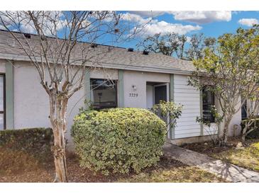 Cute and cozy single story home with a well-manicured lawn at 7729 Country Pl, Winter Park, FL 32792