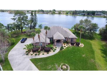 Luxury waterfront home with large lot and circular driveway at 1947 Quintilis Ct, Deltona, FL 32738