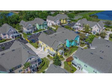 Brightly colored townhomes boast lush landscaping and convenient parking in this desirable community at 3016 Bonfire Beach Dr # 104, Kissimmee, FL 34746