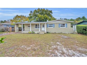 Charming single-story home with a well-maintained lawn and brick facade at 3501 Calumet Dr, Orlando, FL 32810