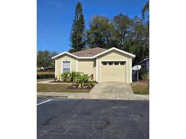 Charming single-story home with a well-maintained lawn and attached one-car garage at 4002 August Ct, Casselberry, FL 32707