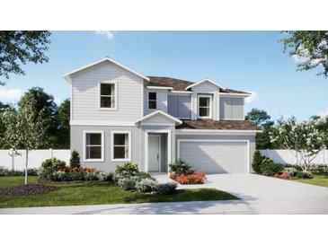 Two-story house with gray siding, brown roof, and landscaped front yard at 434 Marion Loop, Haines City, FL 33844