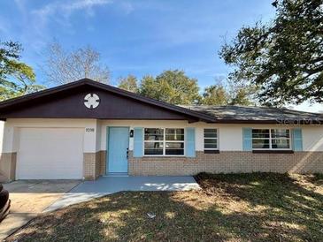 Newly renovated single story home with a landscaped lawn at 1018 4Th St, Port Orange, FL 32129