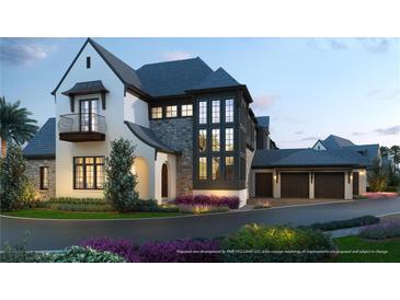 Stunning two-story home with stone accents, a balcony, three-car garage, and beautiful landscaping at 10300 Winter Sparkle Cir, Golden Oak, FL 32836