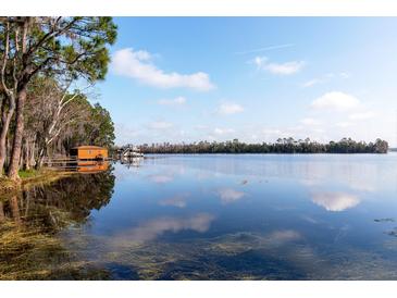 Scenic lakefront property with dock and boathouse at 4135 Chuluota Rd, Orlando, FL 32820