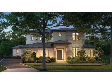 Stunning two-story home with stone accents and a beautifully landscaped yard at 11043 Cromwell Rd, Orlando, FL 32827