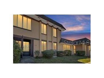 Attractive two-story townhome with covered entry and landscaping at 5419 Fairwood Way # 305, Orlando, FL 32808