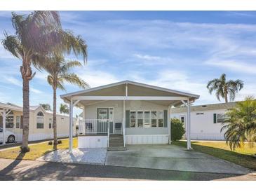 Cute and cozy manufactured home with carport and landscaped yard at 9000 Us Highway 192 # 282, Clermont, FL 34714