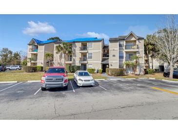 Two-story apartment building with ample parking and landscaping at 1964 Lake Atriums Cir # 175, Orlando, FL 32839
