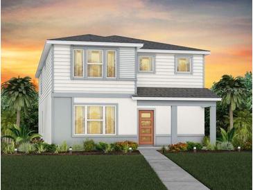 Two-story home with light-colored siding and a walkway at 5026 Starling Bird Ln, St Cloud, FL 34771