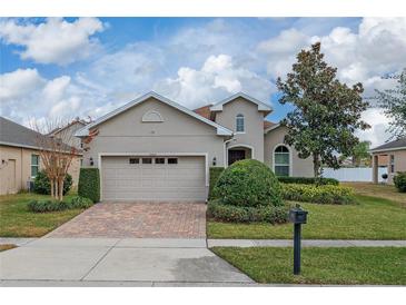 One-story home with a two-car garage and landscaped front yard at 16067 Shasta St, Clermont, FL 34714