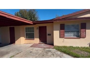 Updated exterior of a charming single-story home with a well-maintained lawn at 2101 La Due Ct, Orlando, FL 32811