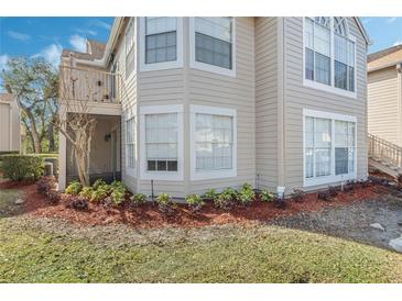 Charming townhouse featuring a private balcony, lush landscaping, and meticulous lawn maintenance at 686 Roaring Dr # 343, Altamonte Springs, FL 32714