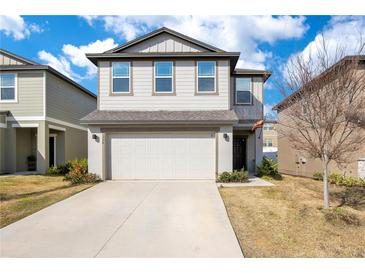 Charming two-story home featuring a two-car garage and a well-maintained front yard at 1778 Sundance Chase Rd, Minneola, FL 34715
