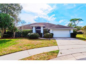 Charming single-story home with well-maintained landscaping and a two-car garage at 4001 Misty Morning Pl, Casselberry, FL 32707