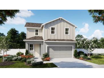 Two-story house with gray siding, landscaping, and a two-car garage at 438 Marion Loop, Haines City, FL 33844