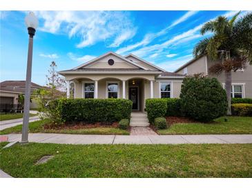 Charming house with landscaped front yard and walkway at 14675 Bahama Swallow Blvd, Winter Garden, FL 34787