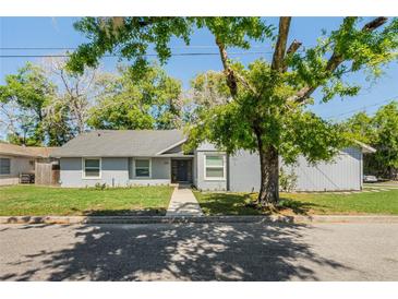 Charming light gray house with a well-maintained lawn and walkway at 2031 Eaton St, Maitland, FL 32751