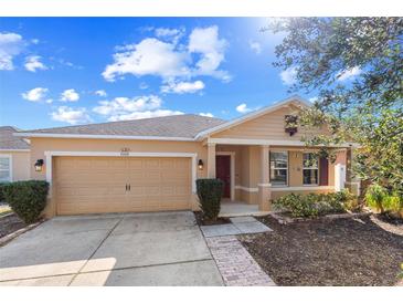 Charming single-Gathering home featuring a two-car garage and well-maintained landscaping in a sunny setting at 8008 Page Ct, Haines City, FL 33844