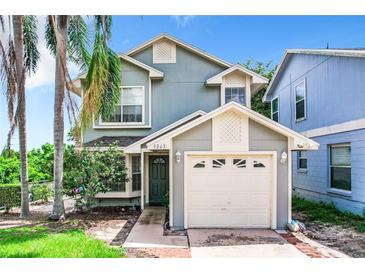 Charming two-story home with mature landscaping and attached garage at 9263 Lake Lotta Cir, Gotha, FL 34734