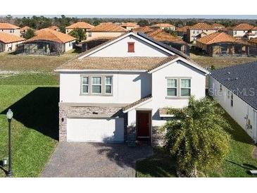 Two-story house in a residential neighborhood at 2089 Camden Loop, Davenport, FL 33837