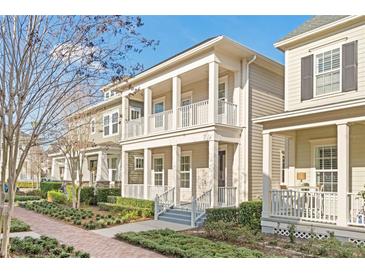 Two-story house with a front porch and landscaped yard at 1413 Resolute St, Celebration, FL 34747