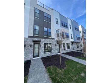 Modern townhouses with gray brick and light-colored siding at 2225 Valentine Aly, Orlando, FL 32804