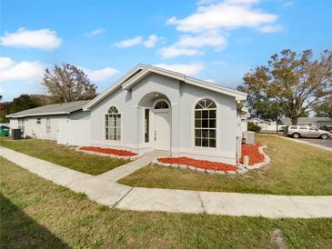 Newly renovated home with a landscaped front yard and walkway at 203 San Gabriel St, Winter Springs, FL 32708