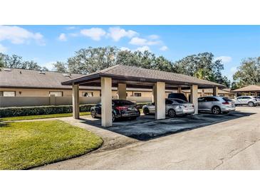 Community carport providing covered parking spaces for residents and visitors, enhancing convenience at 2214 Se Sawgrass Ct, Winter Haven, FL 33884