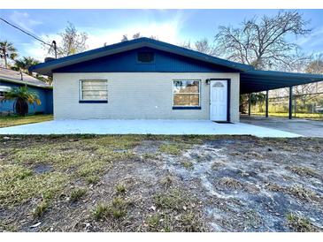 Newly renovated home with blue accents and a carport at 222 Haynes St, Daytona Beach, FL 32114