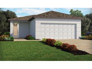 One-story home with a two-car garage and attractive landscaping at 4035 Copperleaf Ln, Poinciana, FL 34759