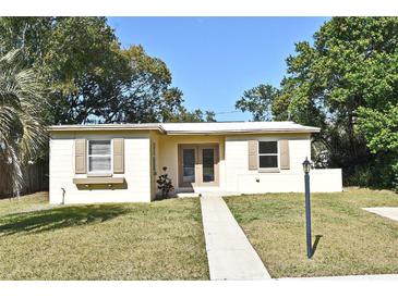 Charming single-story home with a well-maintained lawn and neutral-colored exterior at 878 Rockhill St, Deltona, FL 32725