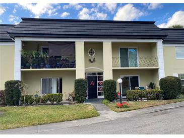 Inviting condo building exterior with landscaping at 1500 Gay Rd # 10C, Winter Park, FL 32789