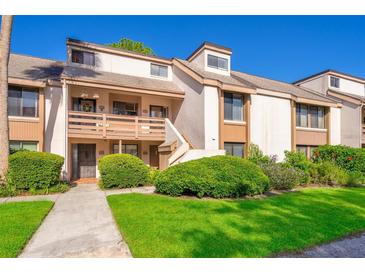 Inviting condo featuring a well-maintained lawn and lush green bushes for enhanced curb appeal at 262 Orienta Point St # 1, Altamonte Springs, FL 32701