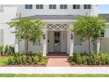 Charming home featuring a beautifully landscaped front yard and inviting front entrance at 3011 Amherst Ave, Orlando, FL 32804
