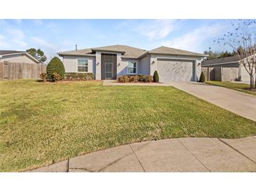 Charming single-story home with manicured lawn and neutral-toned exterior at 3447 Astoria Ct, Winter Park, FL 32792