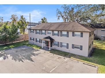 Two-story building featuring a spacious parking lot and traditional architecture at 640 Robinhood Dr # B, Maitland, FL 32751