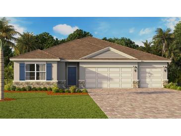 Charming single-story home featuring a two-car garage, blue shutters, stone accents, and a well-manicured lawn at 8608 Bridgeport Bay Cir, Mount Dora, FL 32757