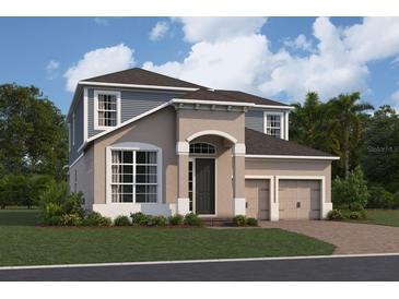 Two-story home featuring a two-car garage, neutral stucco and light blue siding with an arched front porch at 16863 Muskgrass Dr, Winter Garden, FL 34787