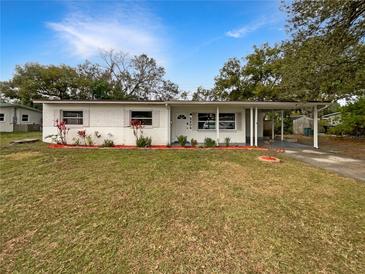 Charming single-story home with a well-maintained front yard and inviting covered entrance at 5404 Milan Dr, Orlando, FL 32810