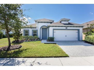 Charming single-Gathering home boasts a well-manicured lawn and welcoming curb appeal at 113 Azure Mist Way, Daytona Beach, FL 32124