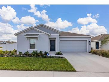 Charming single-Gathering home with a two-car garage, manicured lawn, and appealing curb appeal at 350 Rustic Rail Dr, Lake Wales, FL 33859